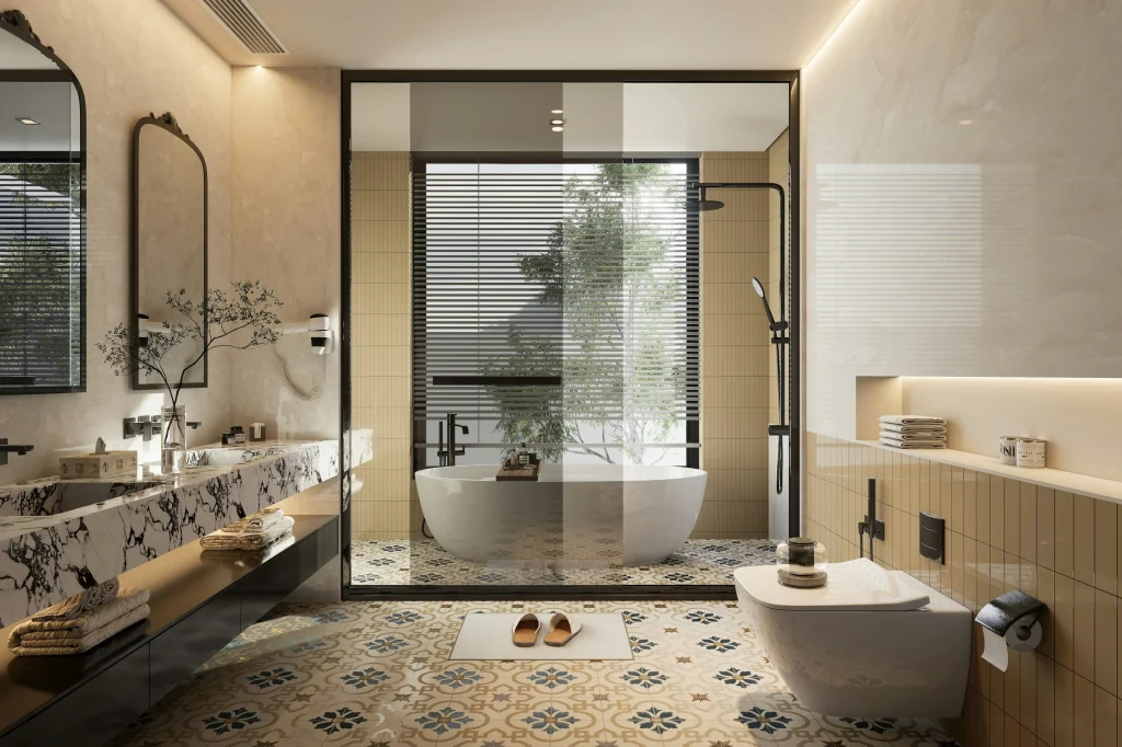 Luxury master bathroom remodel by a professional renovation company in Aurora Highlands, featuring a freestanding oval tub, frameless glass walk-in shower, custom wood double vanity, and gray marble flooring.